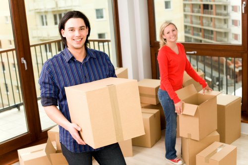 Packed moving boxes and labelled belongings ready for transport